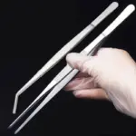 *פינצטה ארוכה רב-שימושית מנירוסטה – כלי חובה לכל בית!* 🔧